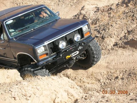 1985 Ford Bronco - This Ford Bronco appears to be from the early 1980s, not a 1985 model, as it navigates rough terrain.