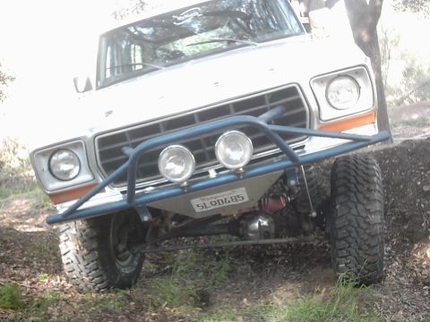 1978 Ford Bronco - This 1978 Ford Bronco is equipped with a custom front bumper and off-road tires, ready for terrain.