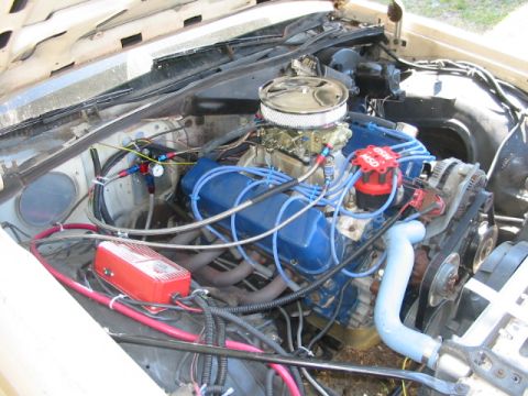 1985 Ford Crown Victoria LTD - Close-up of a V8 engine bay, aftermarket performance parts and wiring.