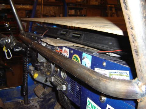 1992 Ford Bronco - Interior view of a blue vehicle's dashboard with various stickers and a roll cage.