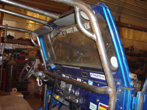 1992 Ford Bronco - Interior view of a modified off-road vehicle, showing the dashboard and roll cage structure.