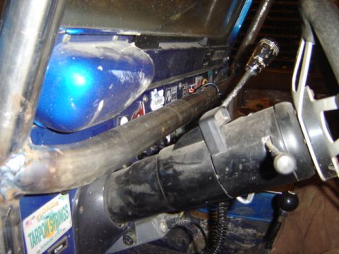 1992 Ford Bronco - Custom interior with roll cage and shifter. The year is not discernible from the image.