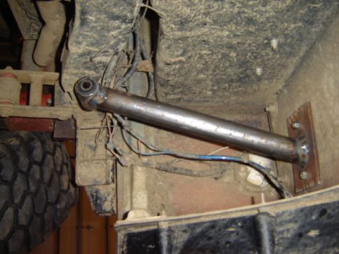 1992 Ford Bronco - Underside view of a custom suspension part, showing welding and mounting hardware.