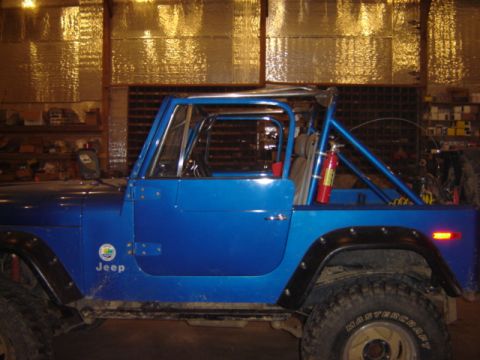 1992 Ford Bronco - This 1992 Ford Bronco is modified for off-road use with a roll cage and large tires.