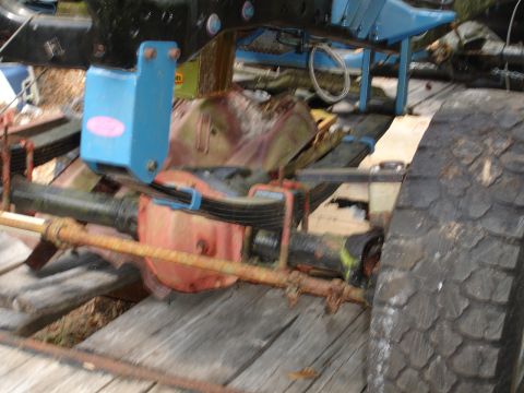 1989 Ford Bronco - Close-up view of the rear axle and suspension system, showing leaf springs and other mechanical parts.