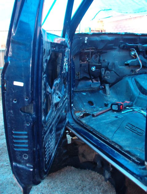 1994 Ford Bronco - I pulled everything out of this door skin, but it'll stay on until the fender comes off, so I have easy access to the hinges.