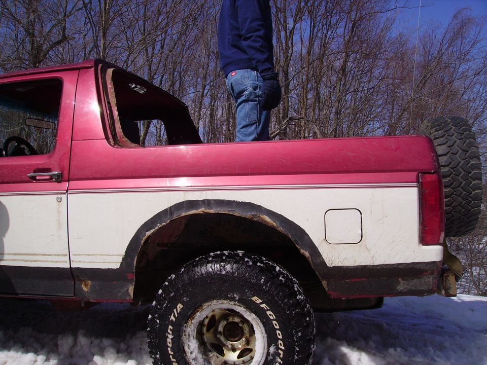 Red and white SUV rear view with spare tire