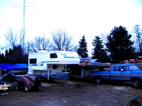 1979 Ford Bronco - 1979 Ford F-Series pickup truck and a camper are parked in a yard.