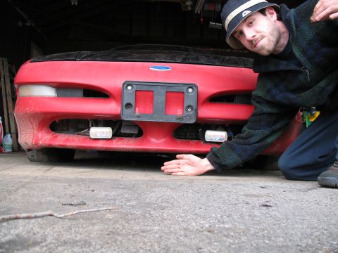 1996 Ford Probe - Front view of a red 1996 Ford Probe, showing the bumper and license plate area.
