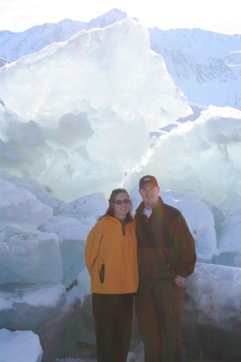 1995 Jeep Cherokee - Couple poses for a photo in a cold, icy landscape with mountains in the background.