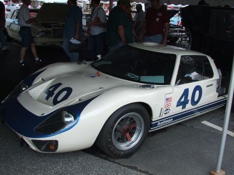 1966 Ford Ranchero - A Holman-sponsored race car, possibly a Ford GT40, is displayed at an event.