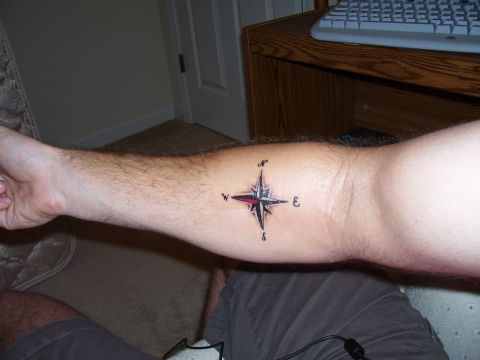 1992 Ford Bronco - Compass rose tattoo on a person's arm.