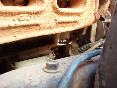 1994 Ford Bronco - The black battery wire goes from the front bolt of the engine mount (on the block) to this tab & up to the battery post, where a smaller bl…