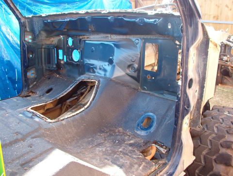1994 Ford Bronco - The interior of a vehicle is shown with its body panels removed, revealing the internal structure.