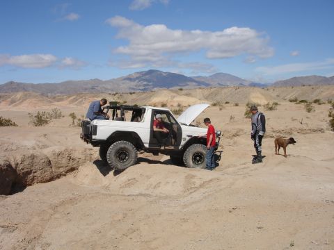 1996 Ford Bronco - Off-roading adventure in the desert with a 1996 Ford Bronco, requiring some roadside assistance.
