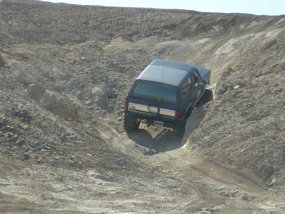 1996 Ford Bronco climbing a steep, rocky incline