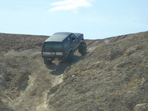 1996 Ford Bronco - This 1996 Ford Bronco is navigating a challenging off-road terrain.