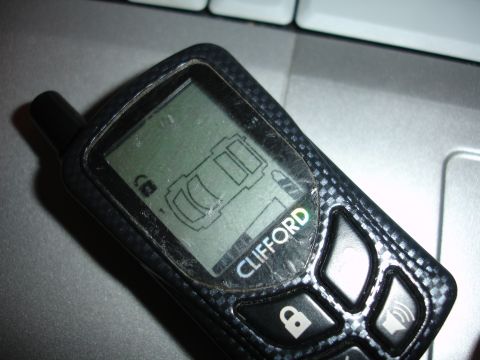 1993 Ford Taurus - Clifford remote car starter fob displays a car icon and lock symbol.