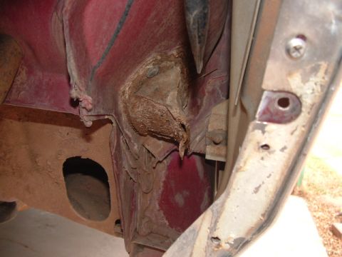 1990 Ford Bronco - Undercarriage view shows a clogged drain area with debris buildup.