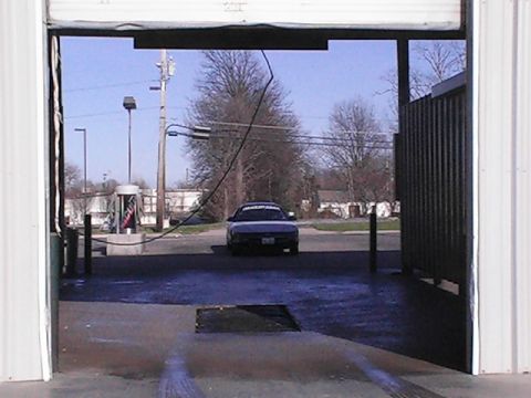 1994 Ford Probe - A 1994 Ford Probe is parked outside a garage on a sunny day.