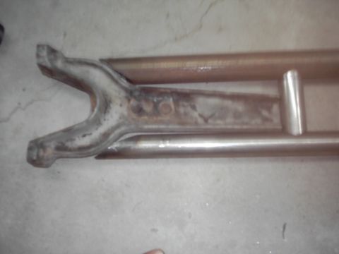 1978 Ford Bronco - Close-up of a rusty radius arm and suspension components, likely from a vehicle.