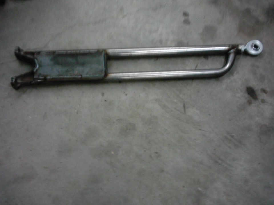 metal suspension radius arm with a U-shaped bracket on one end and a threaded joint on the other