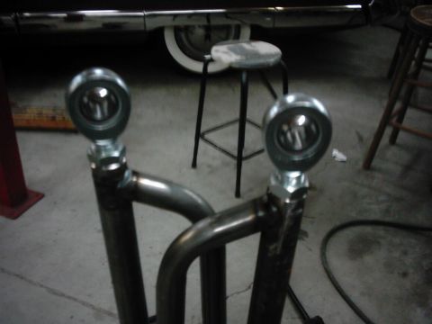1978 Ford Bronco - Custom suspension rod ends are shown in detail, with a vehicle in the background.