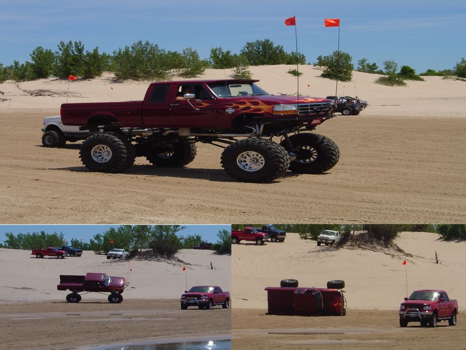 Lifted dark red flame-painted Ford pickup on sand dunes, shown in profile, mid-wheelie, and flipped on its side