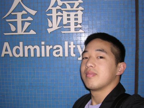 1999 Toyota Tacoma - Man poses in front of a blue tiled wall with text in English and Chinese.