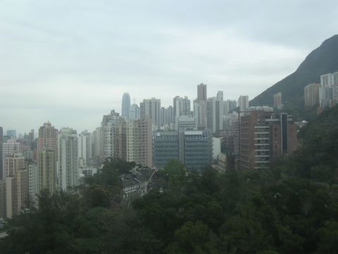 1999 Toyota Tacoma - A panoramic view of Hong Kong's dense urban landscape, with a prominent mountain on the right.