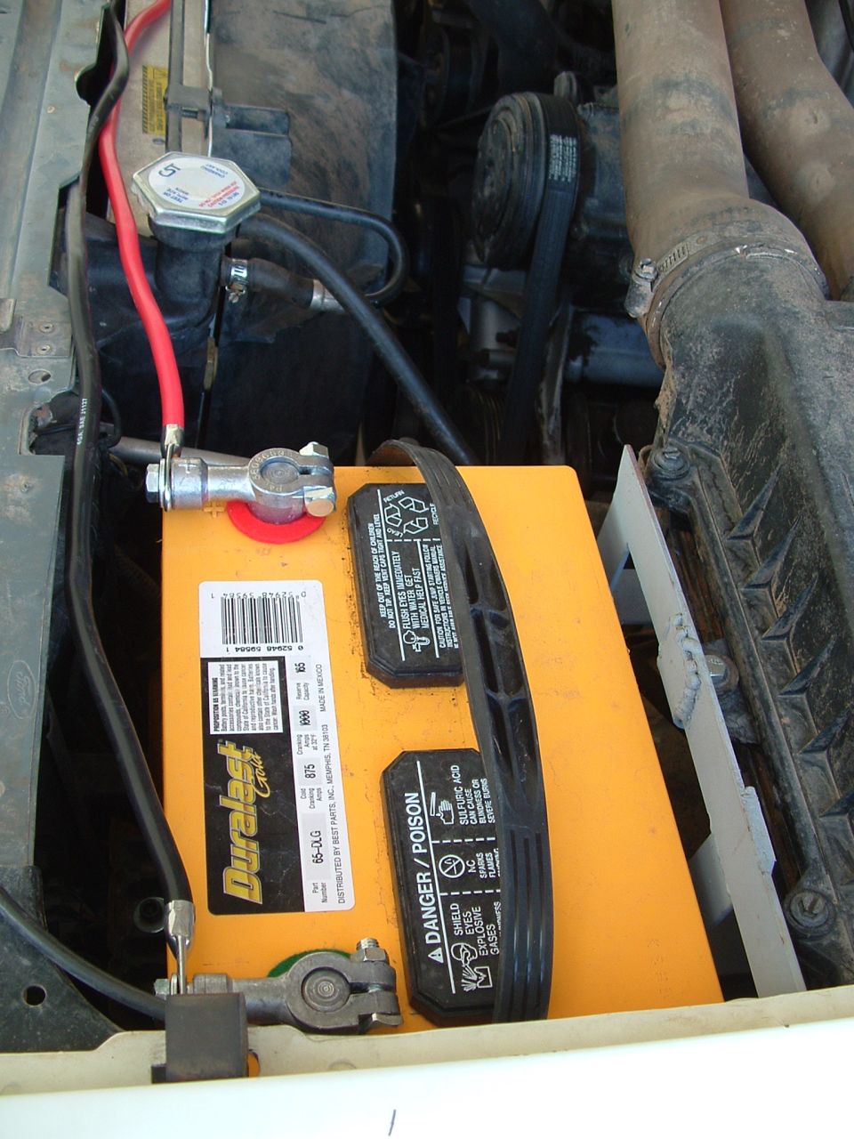 Engine bay with dual Duralast Gold batteries and red cables