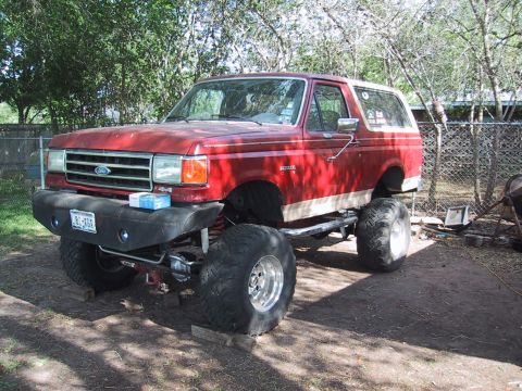 1990 Ford Bronco - This lifted 1990 Ford Bronco features a custom front bumper and oversized tires, giving it a stance.
