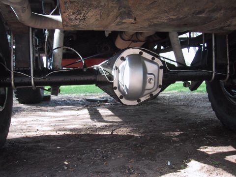 1990 Ford Bronco - Underside view of a vehicle's rear axle differential assembly.