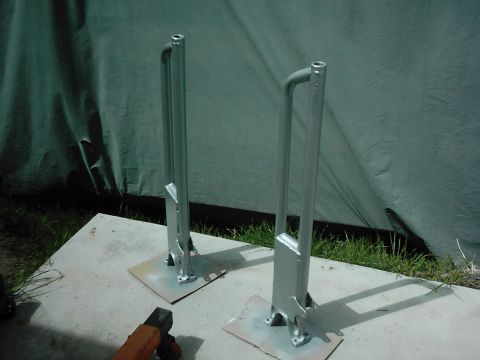 1978 Ford Bronco - Two suspension radius arms, likely for a 4x4 vehicle, are shown after being painted.