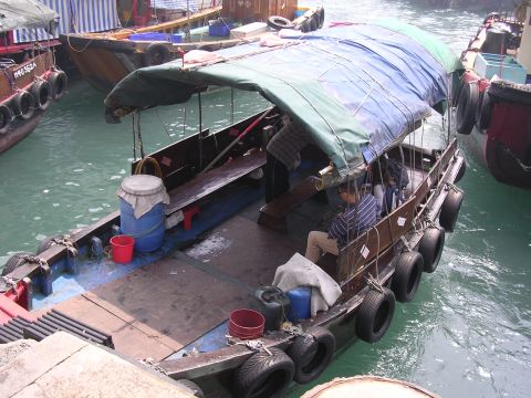 1999 Toyota Tacoma - A collection of boats are moored together in a busy harbor, with some carrying passengers and cargo.