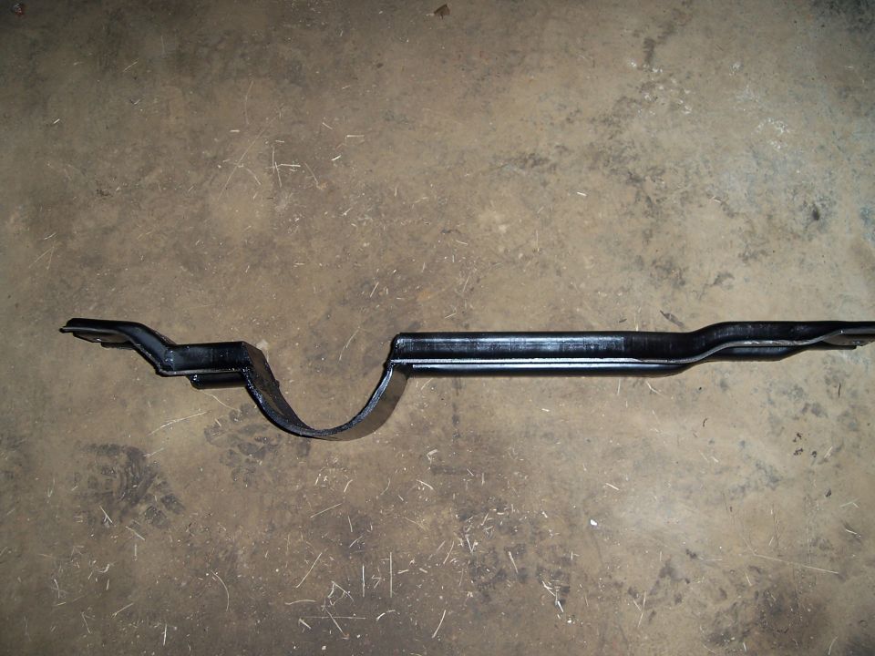 black metal crossmember part on concrete floor
