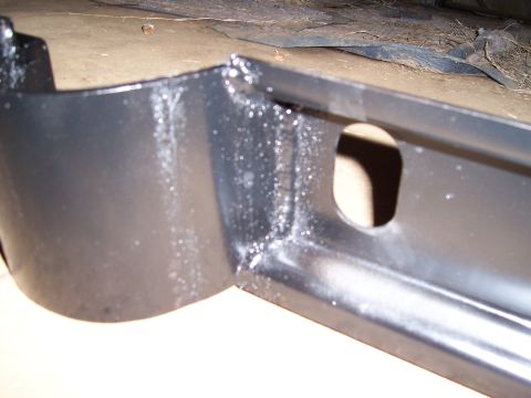1983 Ford Bronco - Close-up view of a painted metal frame component, likely part of a vehicle's undercarriage, with a Supermotors.net watermark.