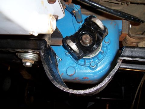 1983 Ford Bronco - Underside view of a vehicle's drivetrain components, focusing on the transfer case and u-joint assembly.