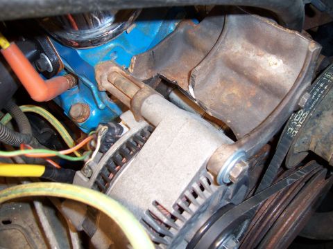 1983 Ford Bronco - Alternator and engine block detail, showing wiring and drive belts.