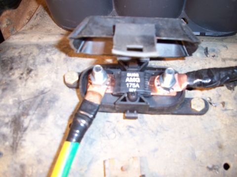 1983 Ford Bronco - This is a close-up view of an automotive fuse holder with visible text indicating its specifications.