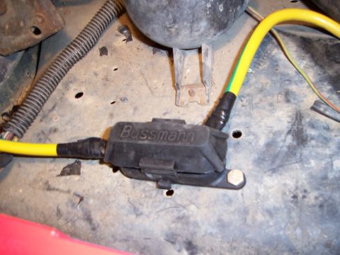 1983 Ford Bronco - Close-up of a fuse holder and wiring in a vehicle's engine bay.