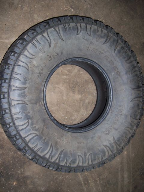 1983 Ford Bronco - Close-up of an Interco Trac ST tire. The registry claims it is a 1983 Ford Bronco, but the photo only shows a tire.