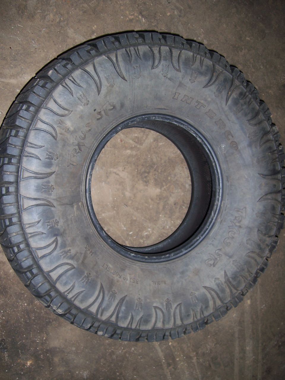Tire with 'INTERCO TRAC ST' text