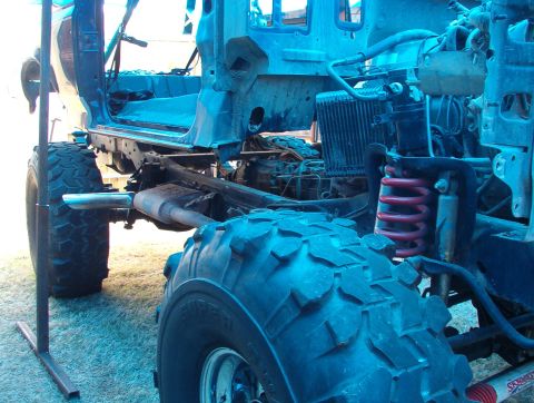 1994 Ford Bronco - This 1994 Ford Bronco is undergoing body removal, showing its chassis and engine components.