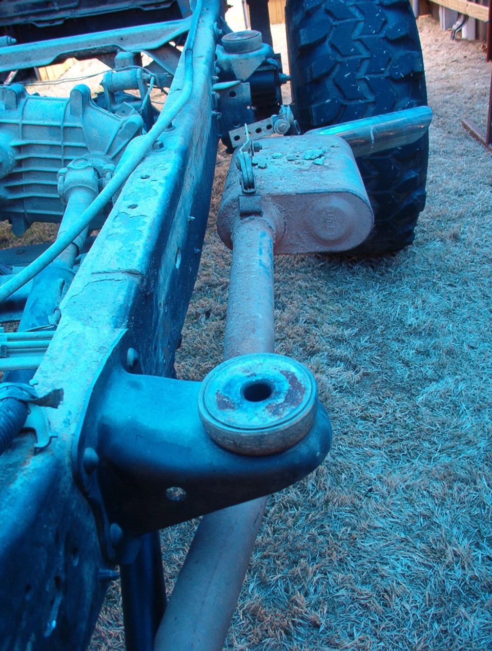 Muffler placement is the reason there's no e-brake.  Also, it should have been hung off the frame instead of the body.