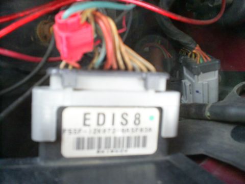 1995 Ford Crown Victoria - Close-up of an EDIS8 engine control module with visible wiring and a barcode label.