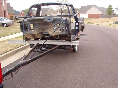 1994 Ford Bronco - The pipe thru the windshield is for the come-along that's holding up the trailer's front axle. Long story...