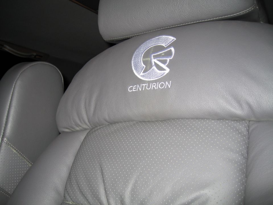 Gray leather seat with embroidered Centurion logo and helmet emblem