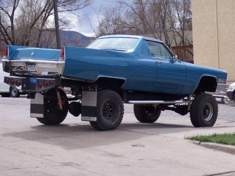 1972 Ford Ranchero - This heavily modified pickup truck features a custom bed and lifted suspension, giving it a unique, appearance.