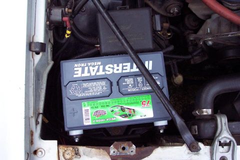 1985 Ford Crown Victoria LTD - Close-up of an Interstate Mega-Tron II battery installed in a vehicle's engine compartment.
